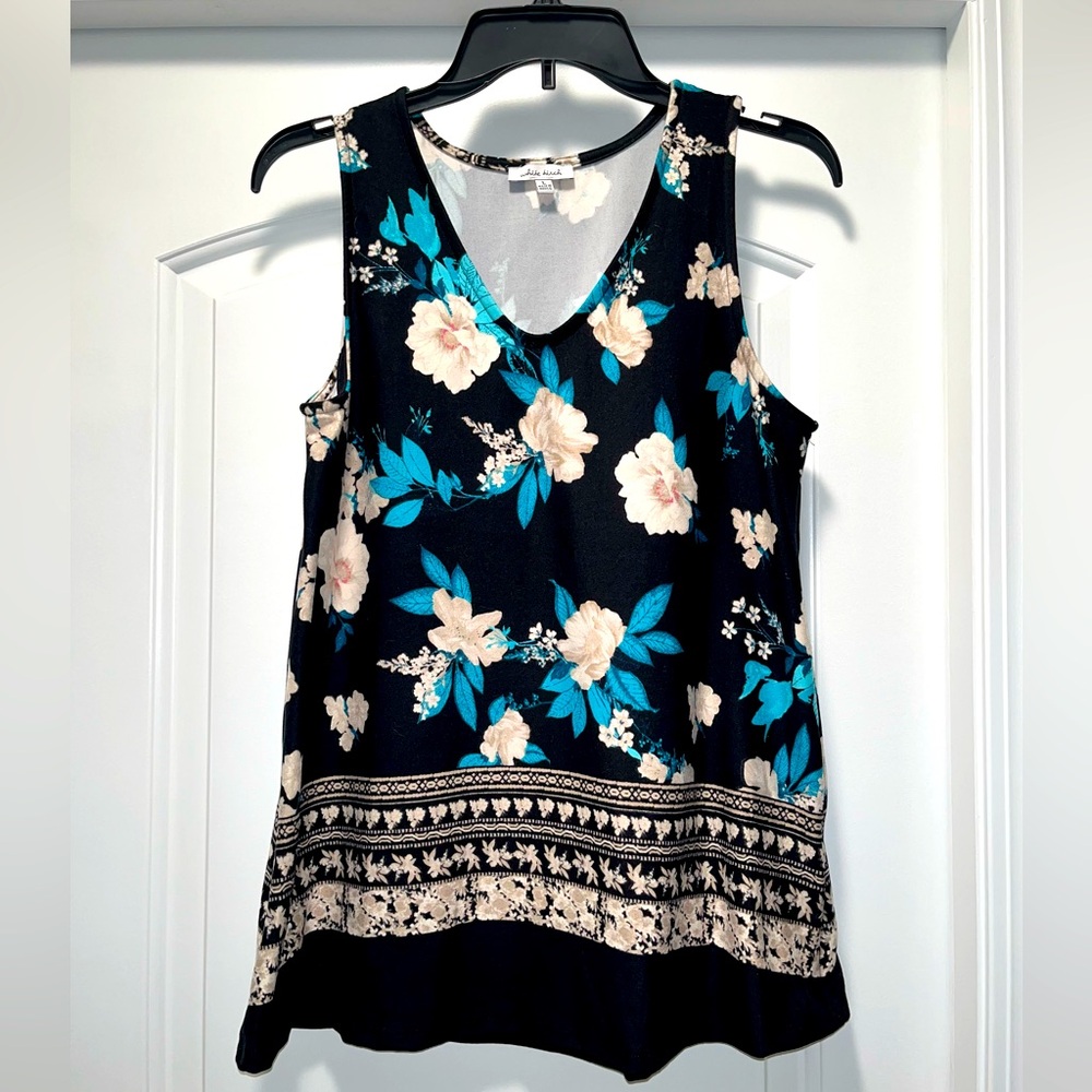 White birch, sleeveless floral print knit top. Washed never worn, size Large